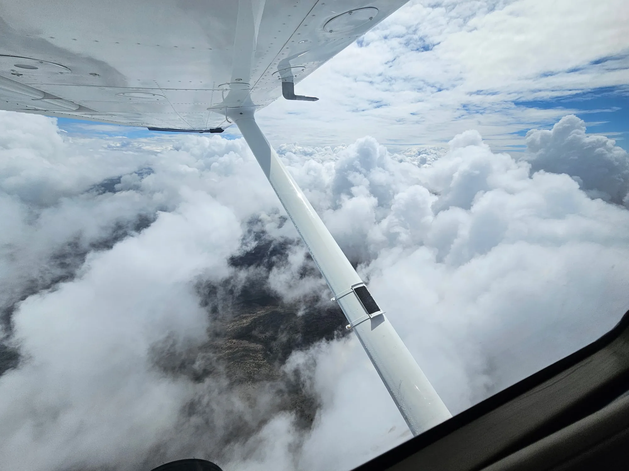 Aircraft flying among building clouds