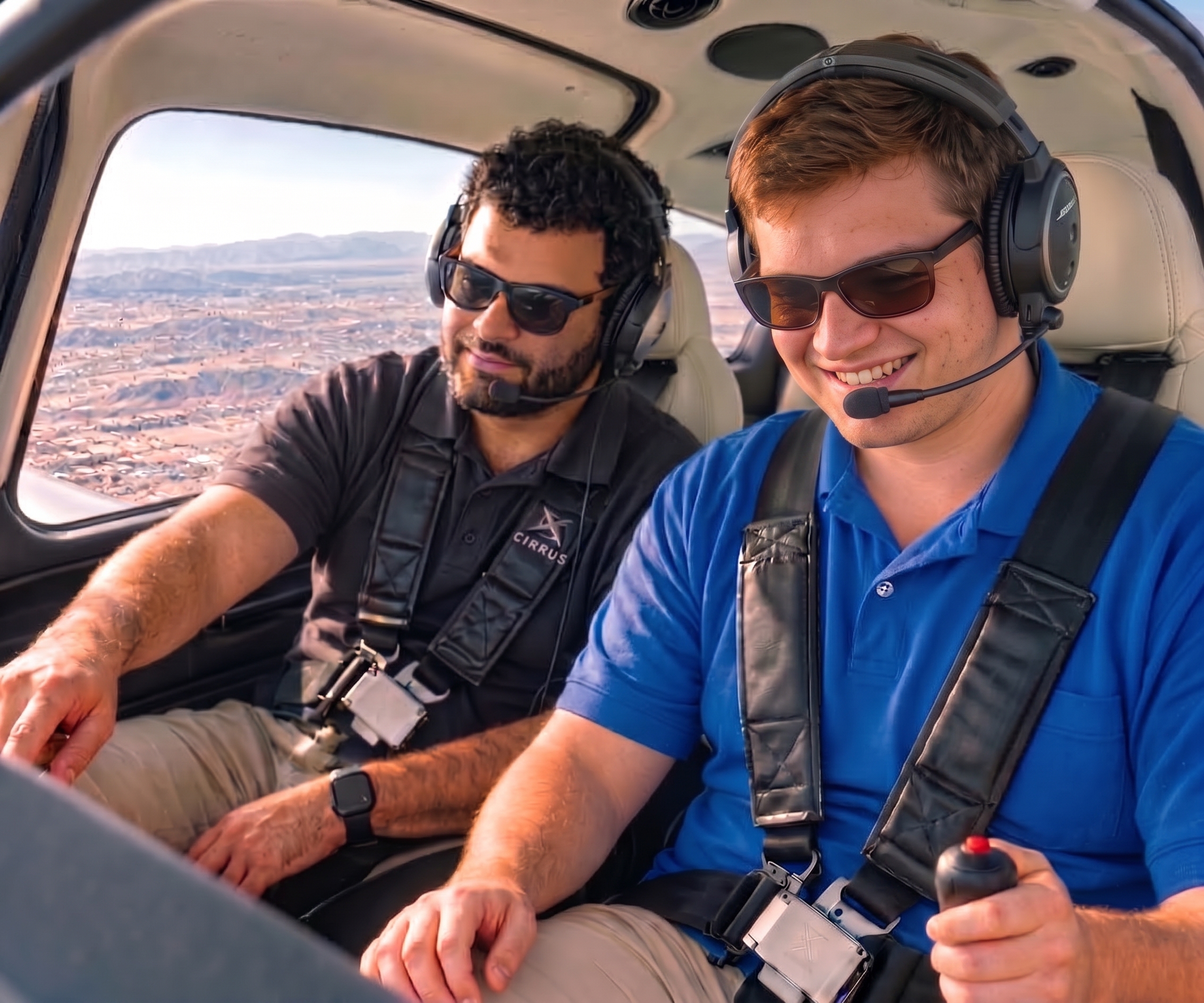 Student pilot flying with a flight instructor beside him in a Cirrus cockpit
